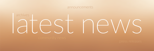 Subtle gradient from soft pumpkin to eggshell with the words latest news in the middle.  Words representing news events are sitting in the back ground.